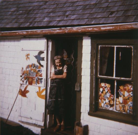 Maud Lewis - Maud Lewis in front of her house, 1961. Photo by Cora Greenaway.jpg